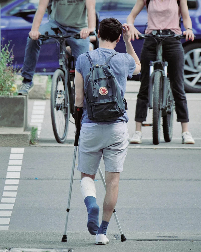 Injured Man on Crutches